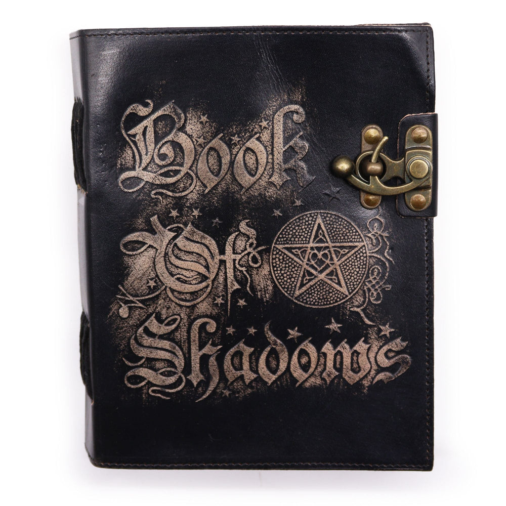Black leather-bound book with 'Book of Shadows' text and pentacle design on a white background