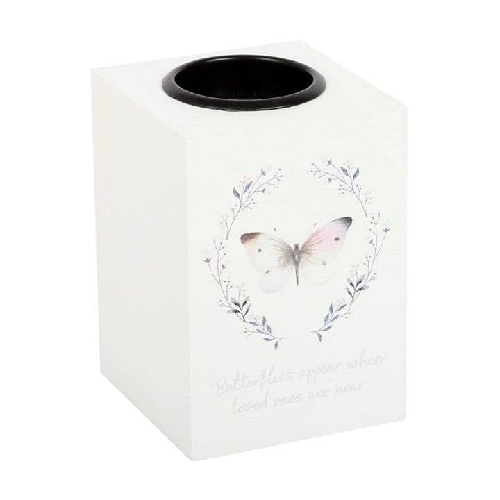 Tissue box cover with butterfly design and text on a white background