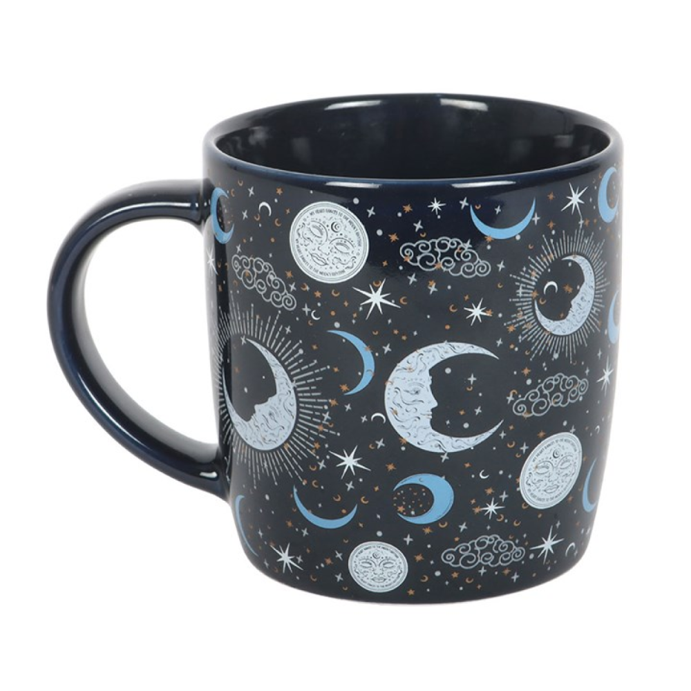 Mug with celestial design featuring moons, stars, and constellations on a dark background.