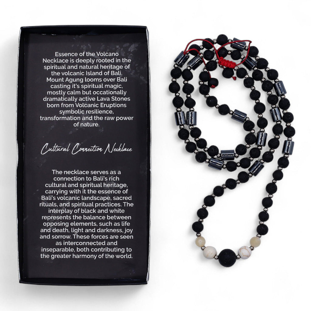 Black beaded necklace with red accents next to a black box with text on a white background