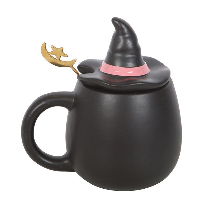 Black mug with witch hat lid on a white background