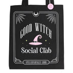 Black tote bag with 'Good Witch Social Club' text and pink witch hat design on a white background