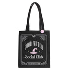 Black tote bag with 'Good Witch Social Club' design on a white background