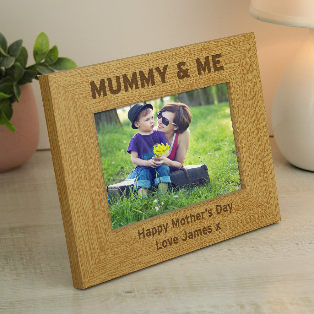 Wooden photo frame with 'Mummy & Me' engraving and a photo of a woman and child outdoors.