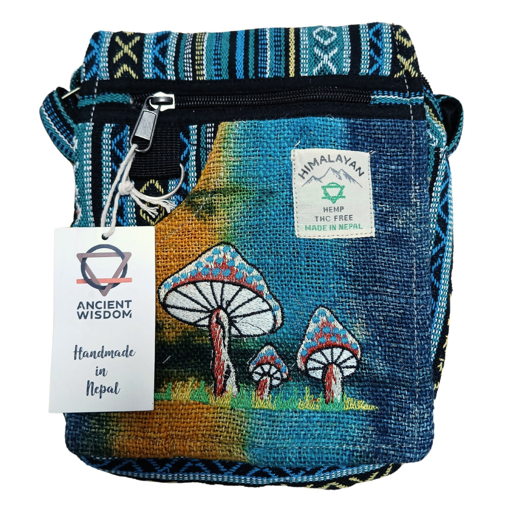 Handmade blue bag with mushroom design and Himalayan label on a white background