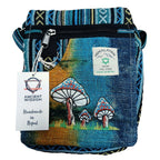 Handmade blue bag with mushroom design and Himalayan label on a white background