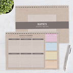 Personalized study notes and planner with sticky notes on a white surface.