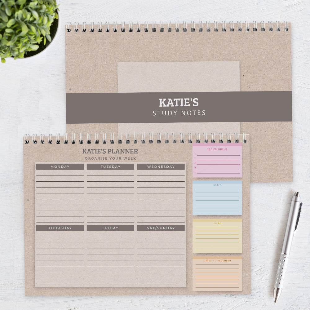 Personalized study notes and planner with sticky notes on a white surface.