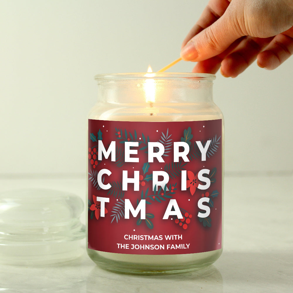 Candle being lit with a 'Merry Christmas' label on a white background