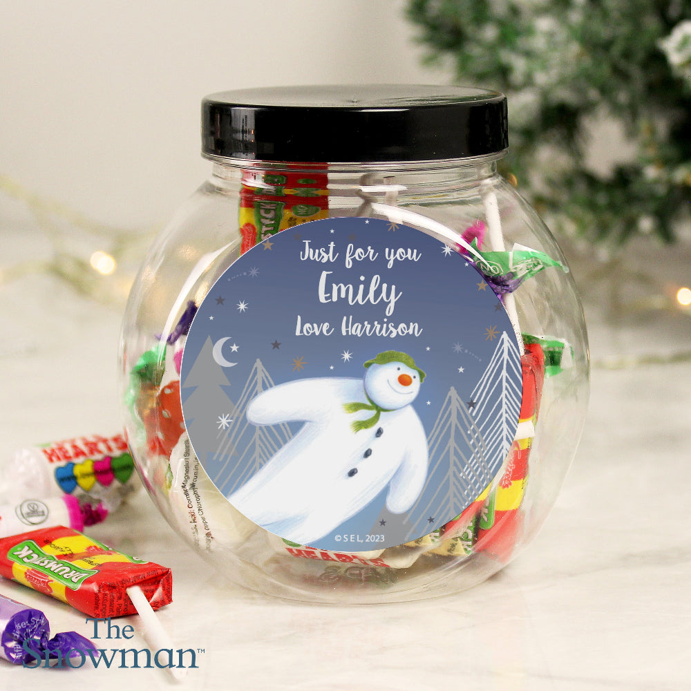 Jar of candies with a personalized snowman label on a light background