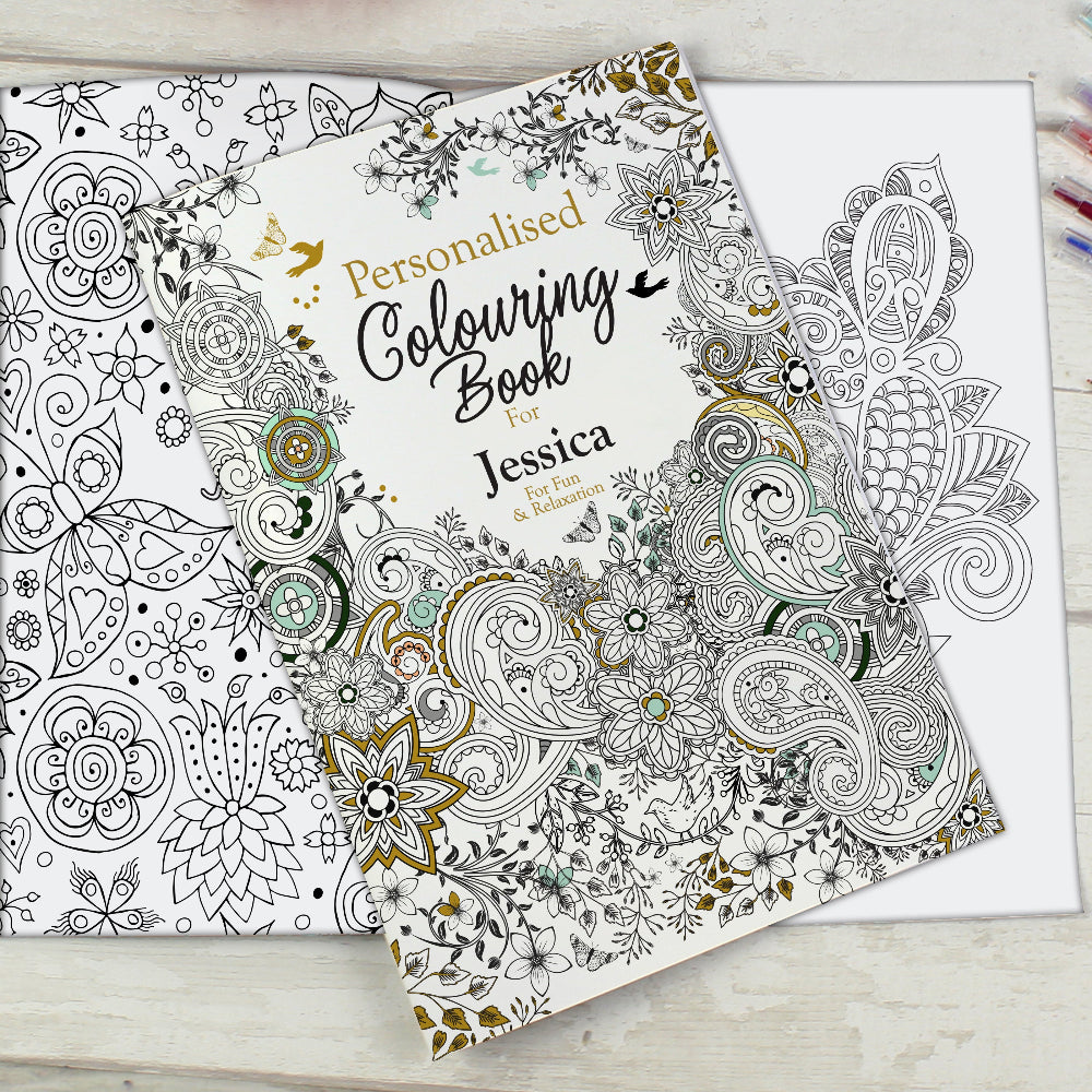 Personalised coloring book with intricate patterns on a wooden surface