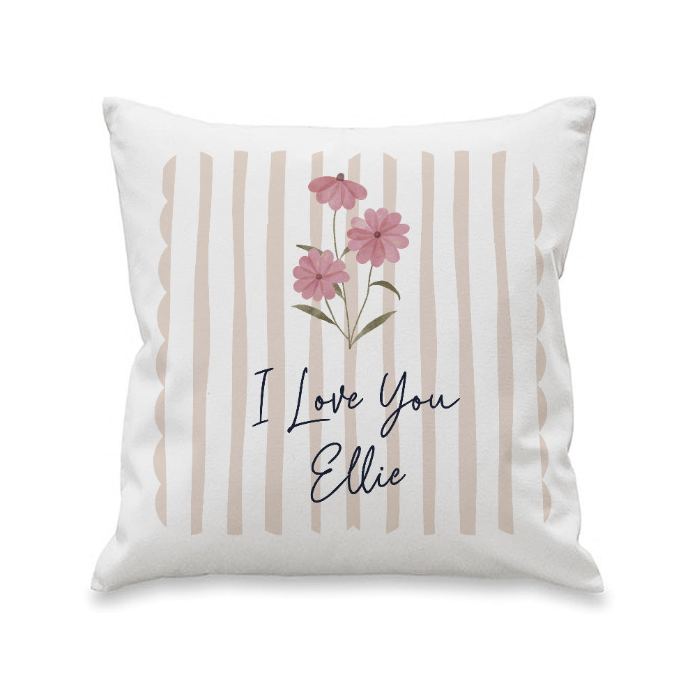 Decorative pillow with floral design and 'I Love You Ellie' text on a white background