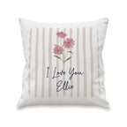 Decorative pillow with floral design and 'I Love You Ellie' text on a white background