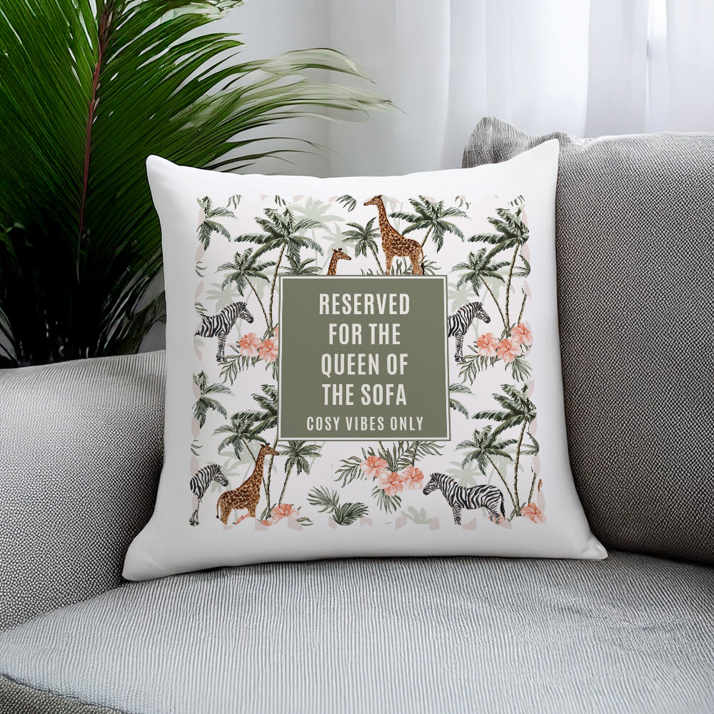 Decorative pillow with animal print and text on a sofa