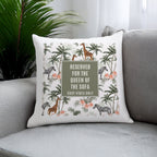 Decorative pillow with animal print and text on a sofa