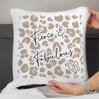 Pillow with leopard print and 'Fierce & Fabulous' text held by a person.