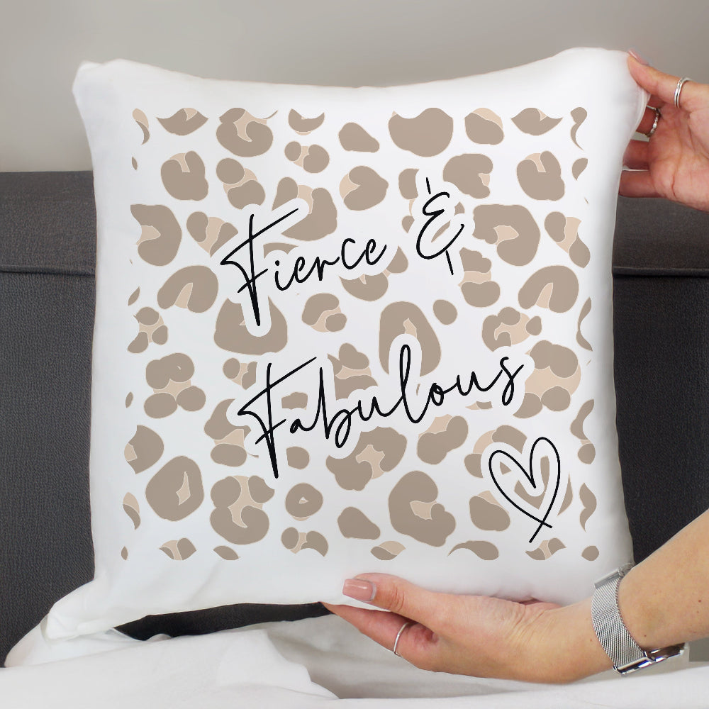 Pillow with leopard print and 'Fierce & Fabulous' text held by a person.