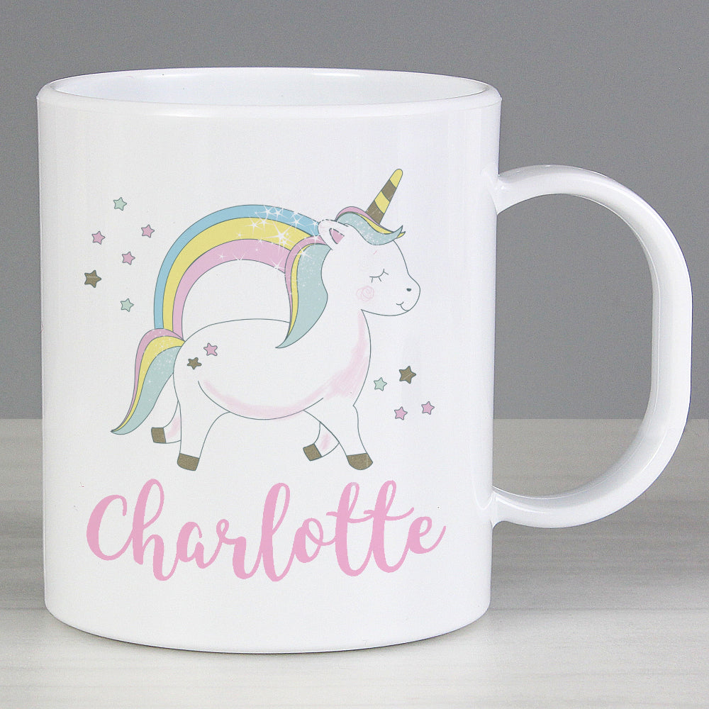 White mug with a unicorn design and the name 'Charlotte' on a gray background