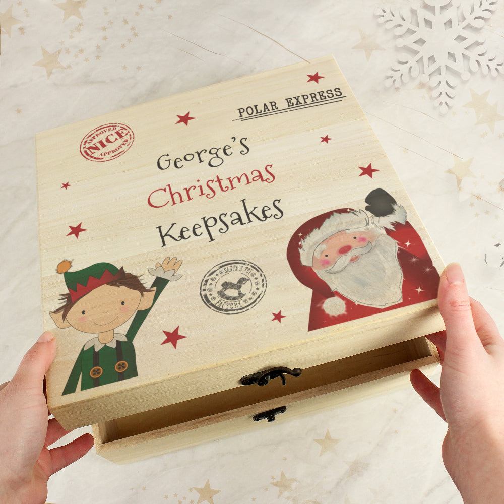 Wooden box labeled 'George's Christmas Keepakes' with festive illustrations on a light background.