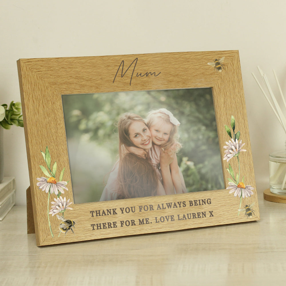 Wooden photo frame with floral design and engraved message, featuring a photo of a woman and child outdoors.