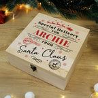 Wooden gift box with personalized text under a Christmas tree