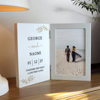 Personalized photo frame with a couple on a beach and engraved text.