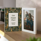 Personalized photo album with a couple on the cover and jungle leaf design.