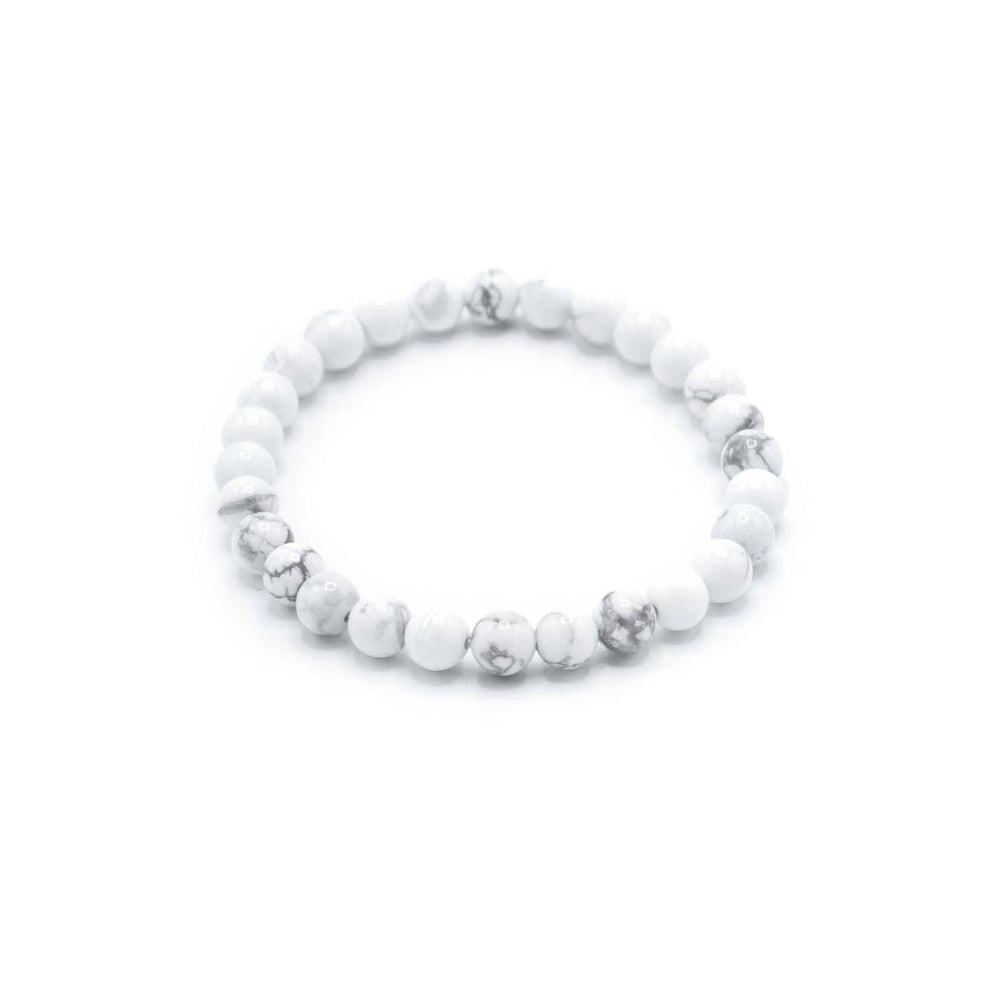 White beaded bracelet on a white background