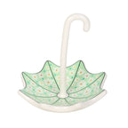 Decorative umbrella stand with floral pattern on a white background