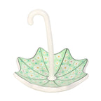 Decorative umbrella stand with a green floral pattern on a white background