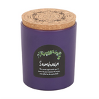 Purple candle with cork lid and 'Samhain' label on a white background