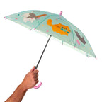 Children's umbrella with animal illustrations held by a hand on a white background