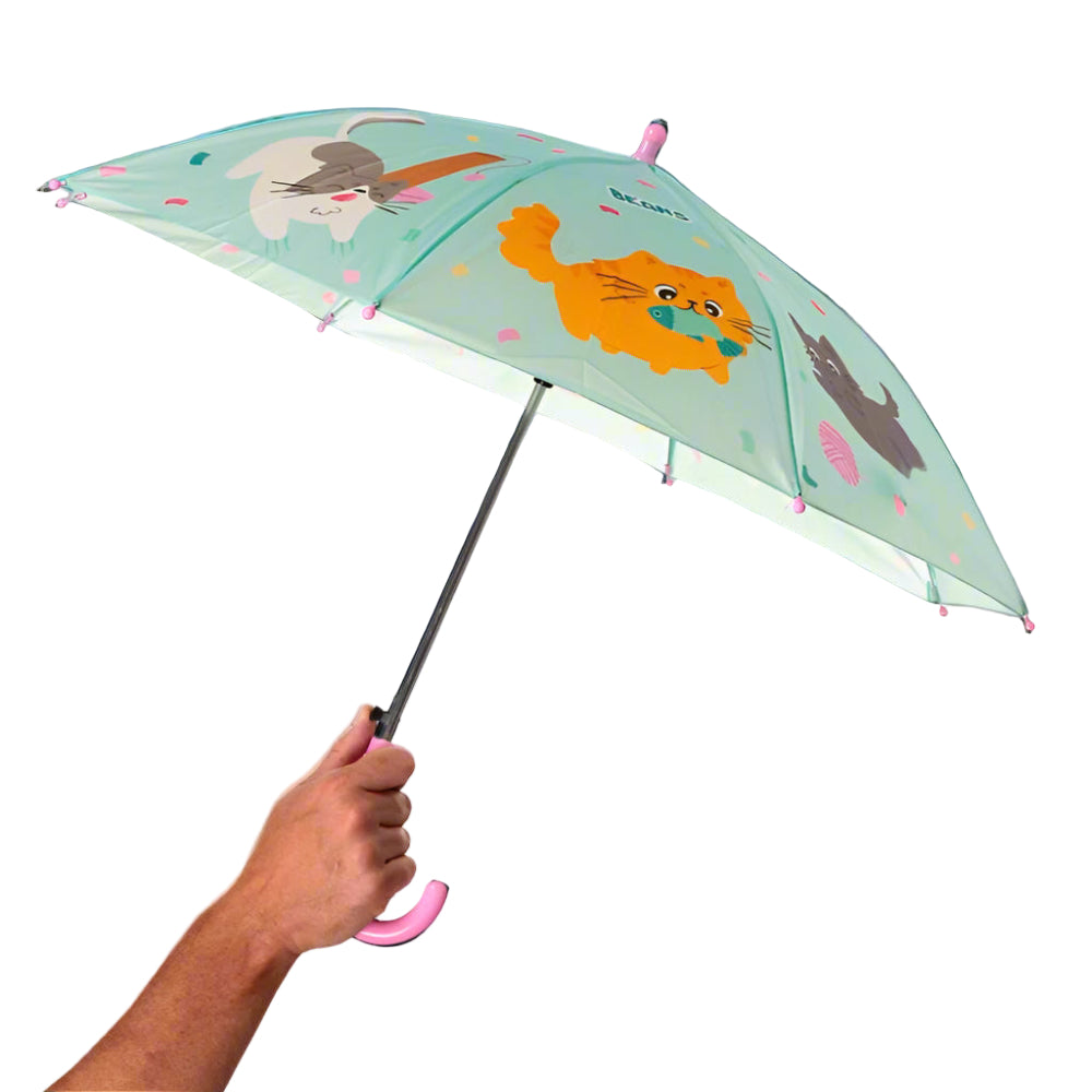 Children's umbrella with animal illustrations held by a hand on a white background