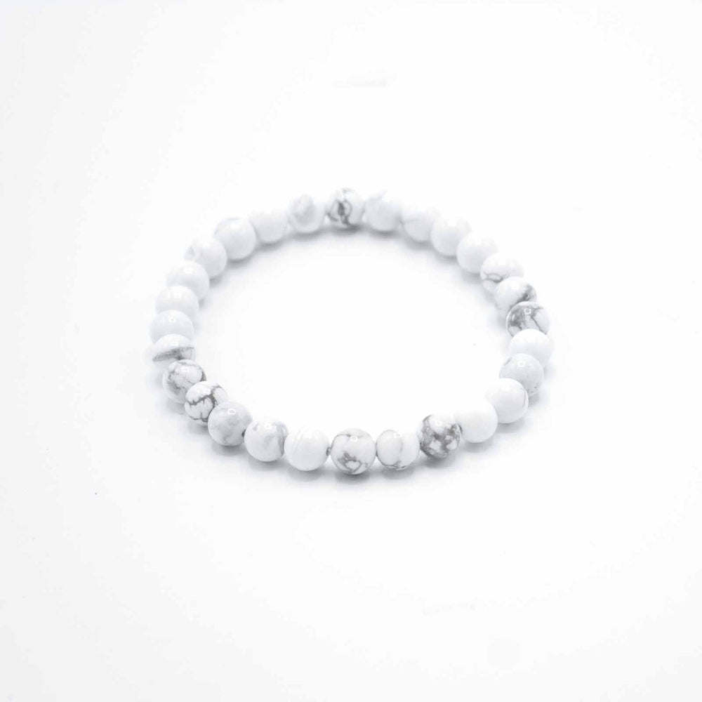 White beaded bracelet on a white background