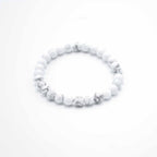 White beaded bracelet on a white background