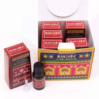 Banjara Classic Aroma Oil packaging with a bottle of Dragon Blood oil on a white background