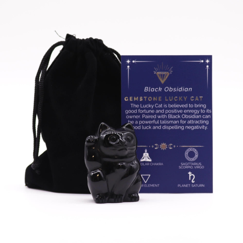 Black obsidian gemstone lucky cat with packaging on a white background