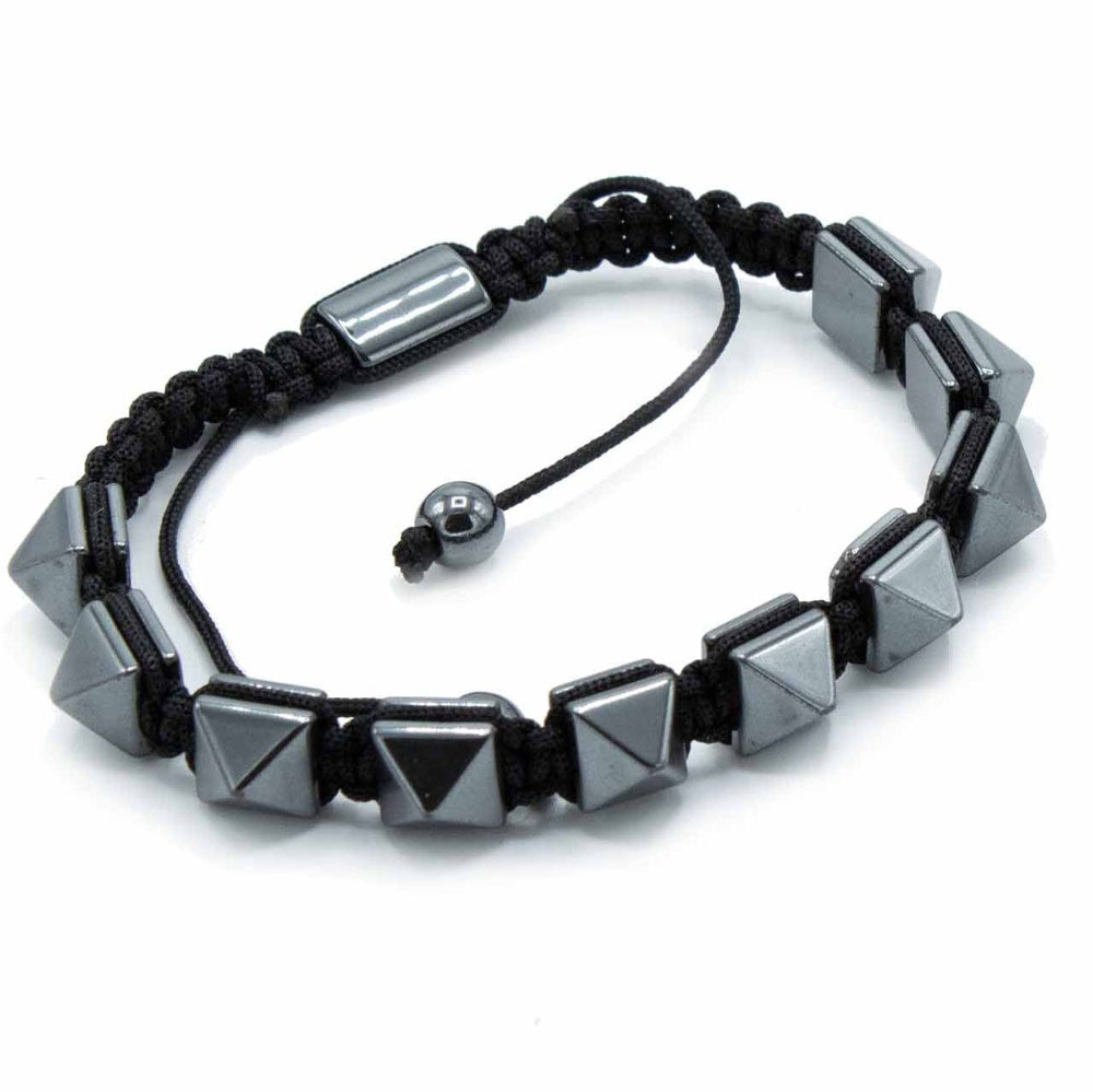 Black braided bracelet with geometric beads on a white background