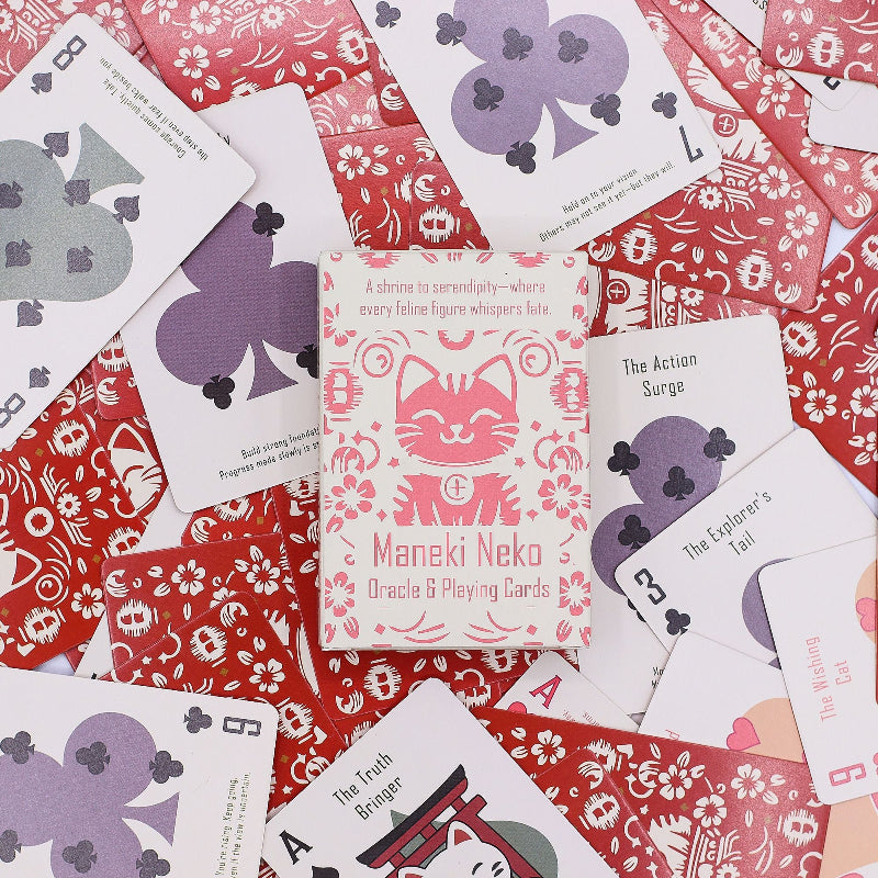 Maneki Neko Oracle and Playing Cards set on a red and white patterned surface