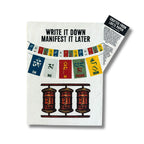 Notebook with prayer flag design and text 'Write it Down Manifest it Later' on a white background
