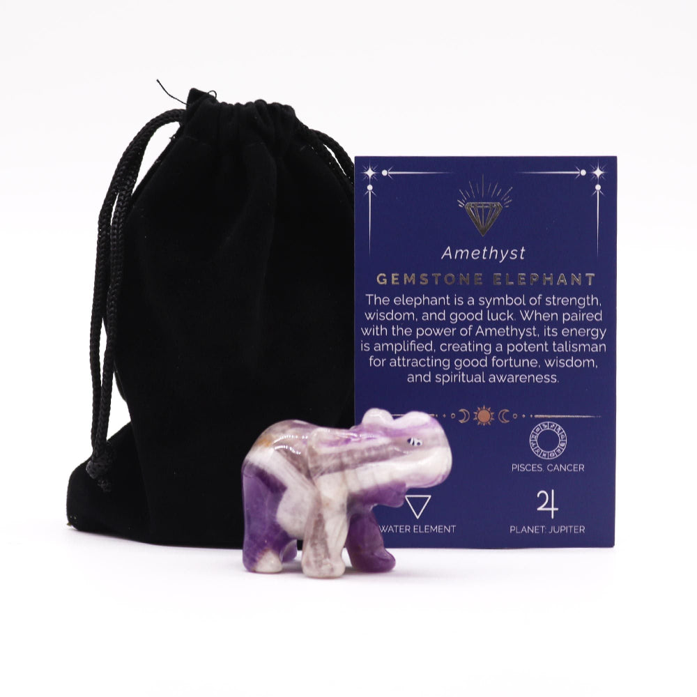 Amethyst gemstone elephant with packaging and black drawstring bag on a white background