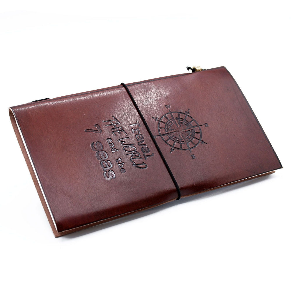 Brown leather notebook with embossed design on a white background