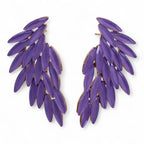 Pair of purple leaf-shaped earrings on a white background