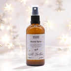 Room spray bottle  with a white Christmas scent on a blurred background. Eleanoras