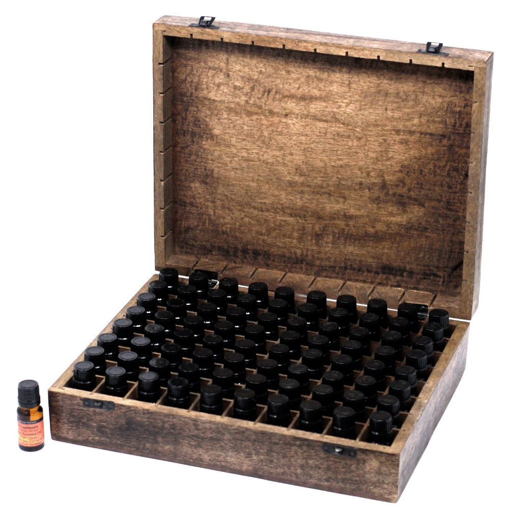 Wooden box with compartments for small bottles, with a few bottles outside on a white background