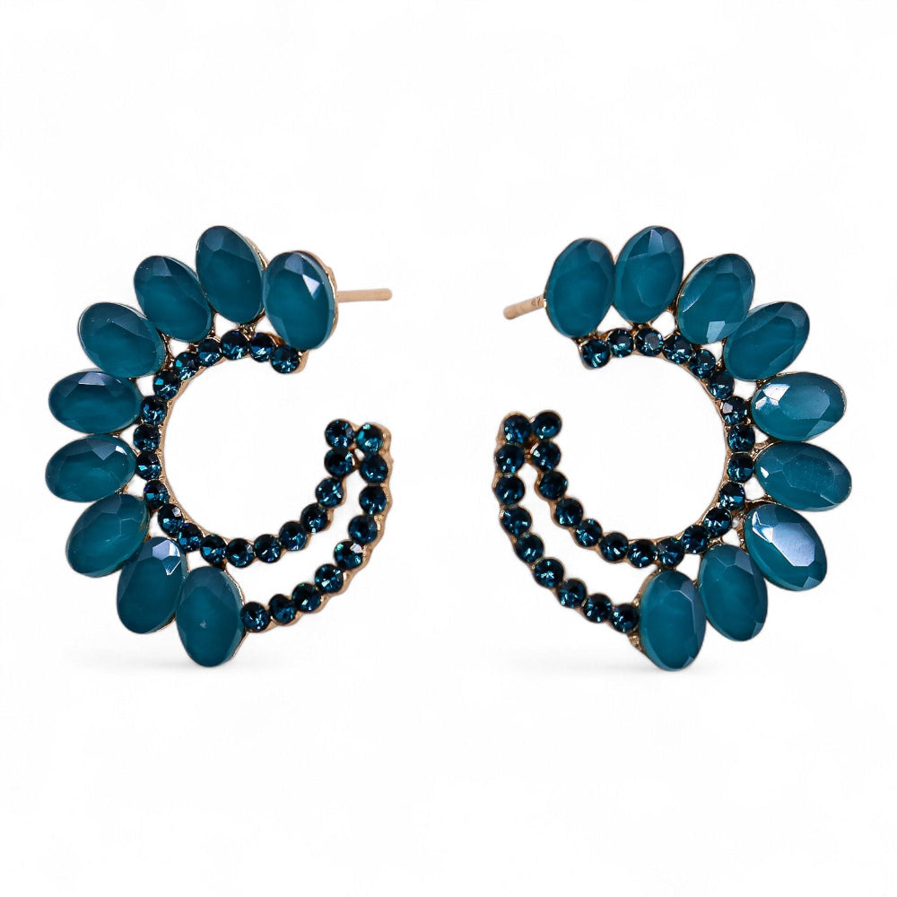 Pair of blue hoop earrings with beaded accents on a white background