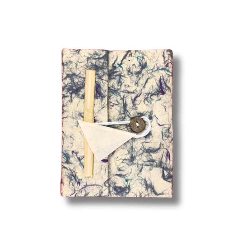 Marbled notebook with a button closure on a white background