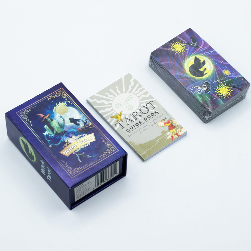 Tarot cards with packaging and guidebook on a white background