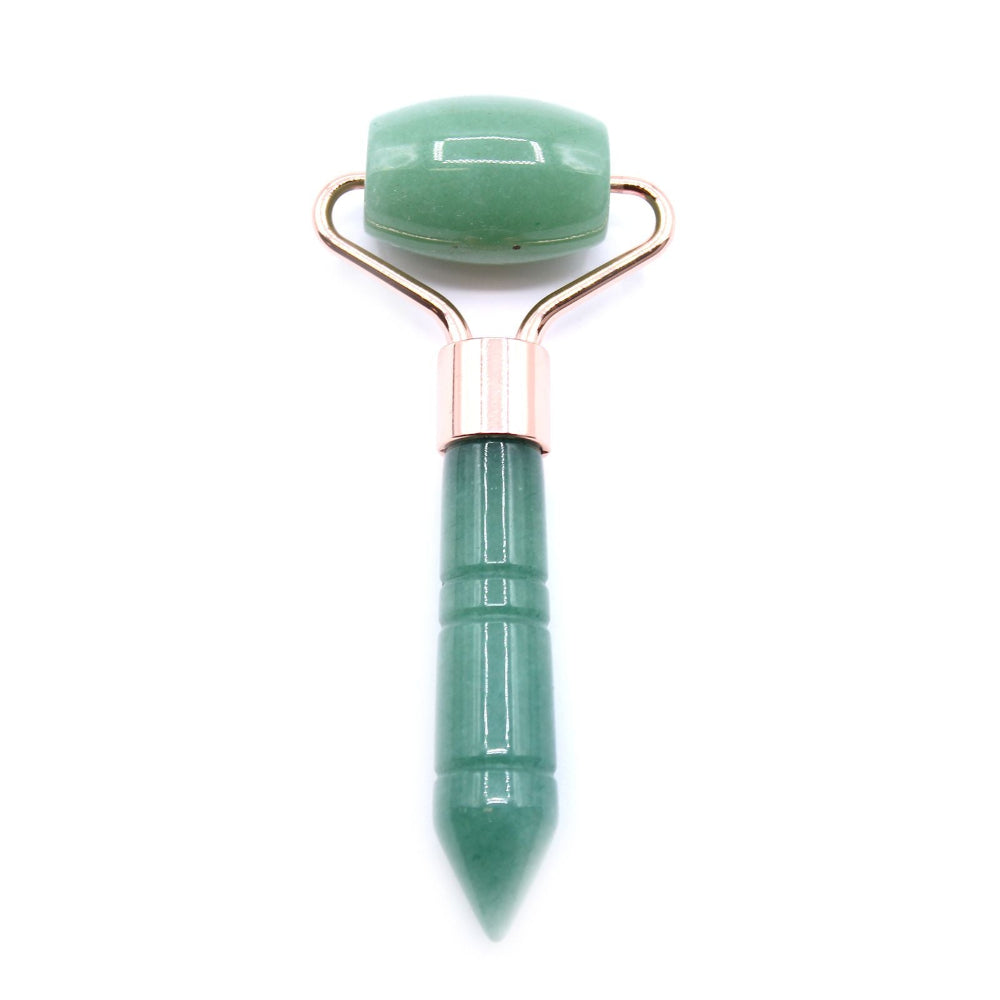 Green jade roller with rose gold handle on a white background