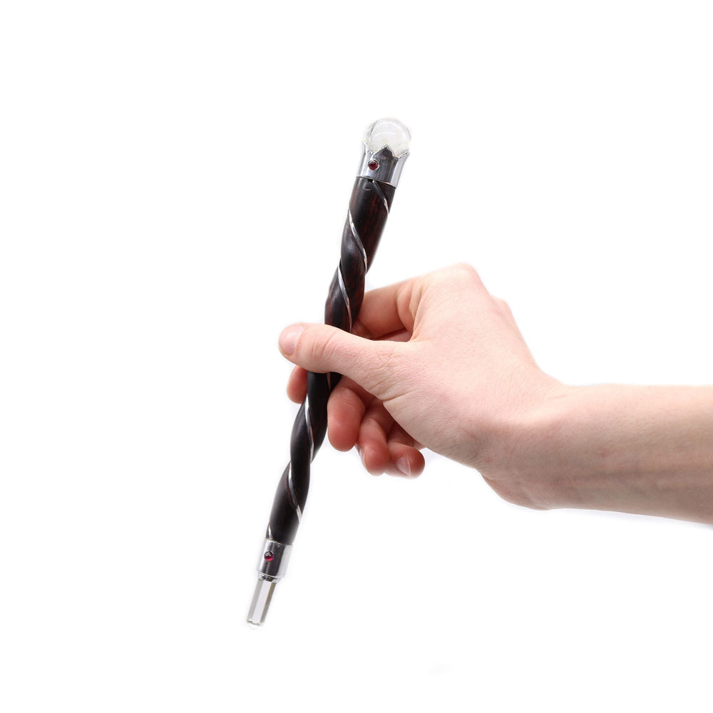 Hand holding a black and silver twisted pen against a white background